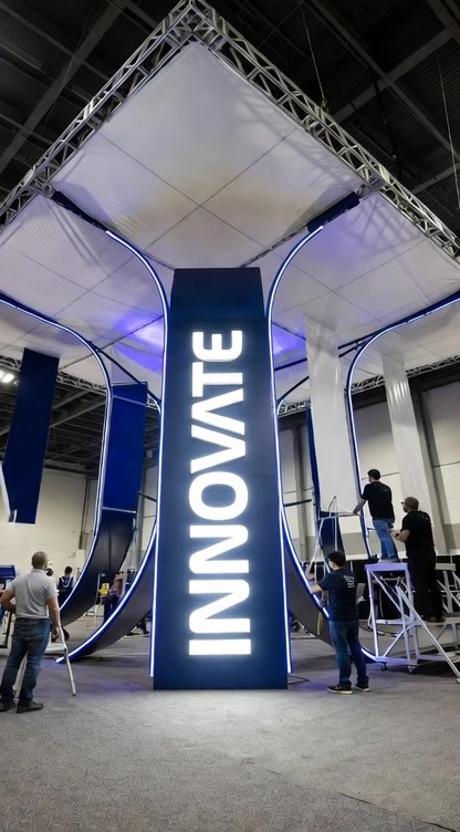 Backlit tension-fabric graphics on a large-format exhibit wall